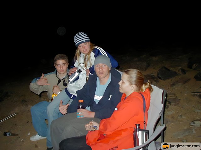 Four People Sitting in the Dark