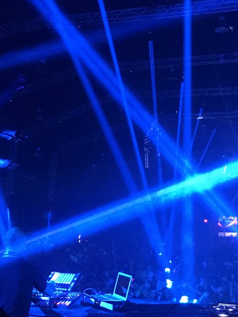 Nightclub Rock Concert with DJ and Blue Lighting