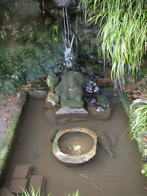 Serene Pond with Buddha Statue