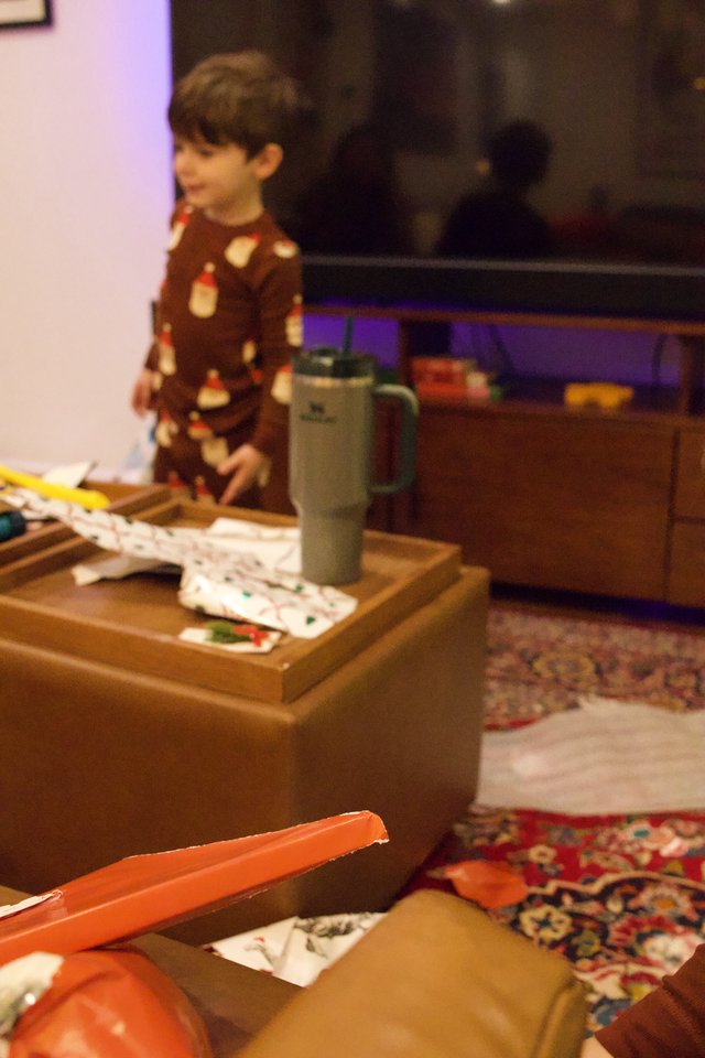 Christmas Morning Unwrapping in Cozy Living Room