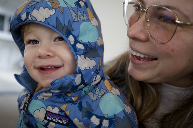 Joyful Winter Moment: Mother and Child in Blue Patagonia