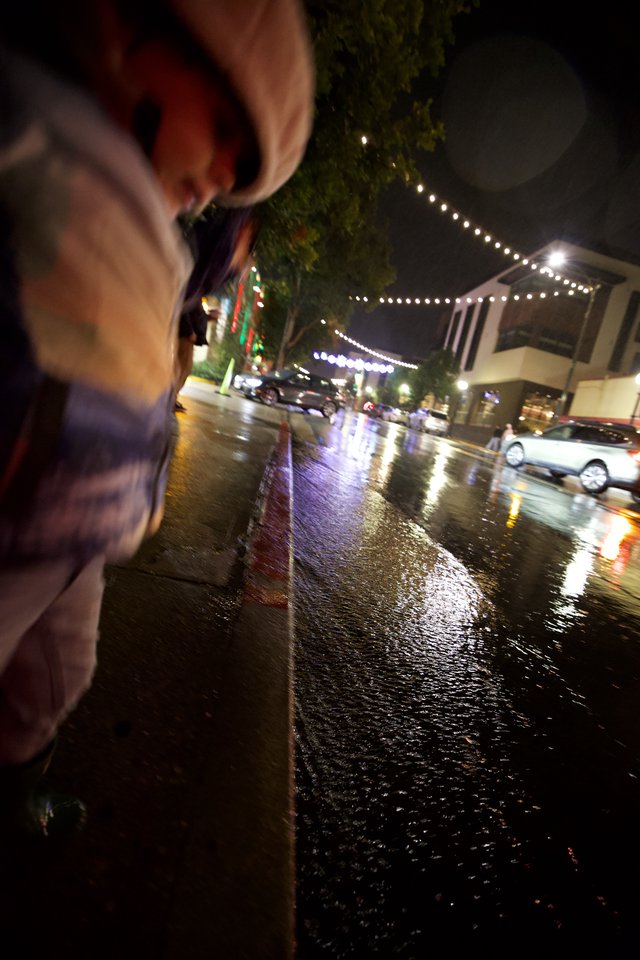 Rainy Night Street Scene with String Lights