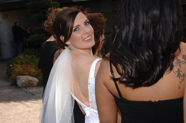 Radiant Bride Glances Back at Wedding Celebration