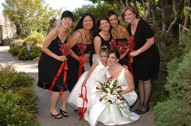 Bride and Bridesmaids Celebrate in Garden Setting