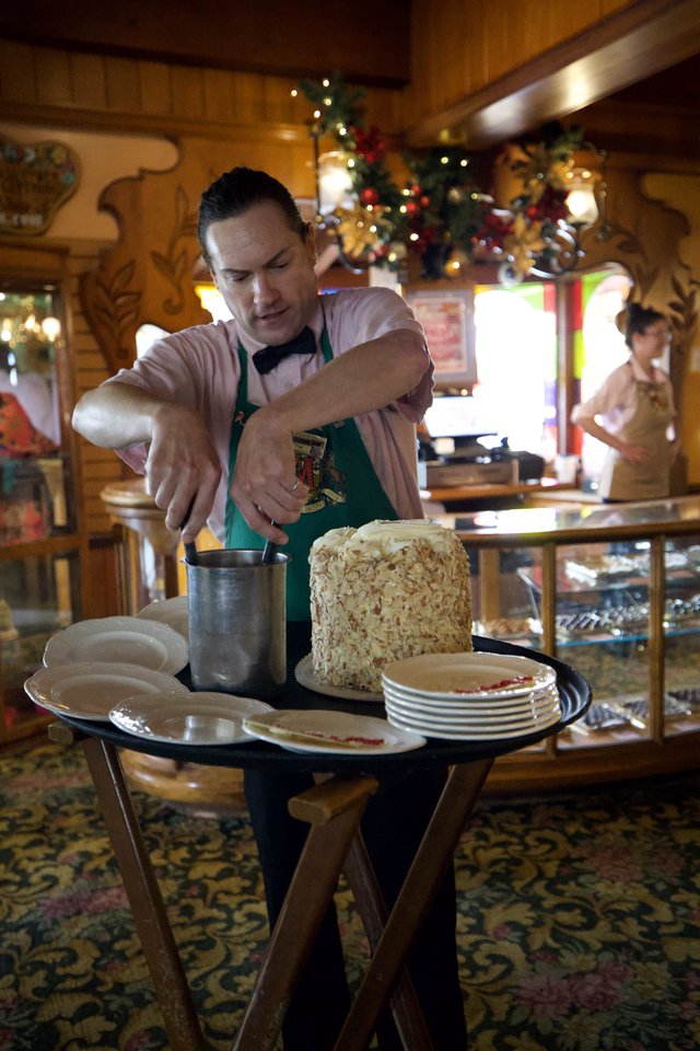 Pastry Chef Preparing Almond-Crusted Dessert at Holiday Station