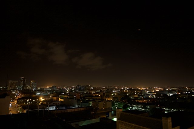 City Lights Under Lunar Eclipse