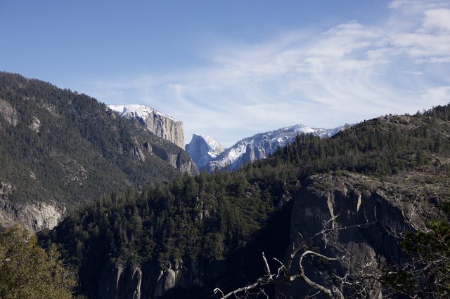 Half Dome Framed by Snowy Granite Cliffs
