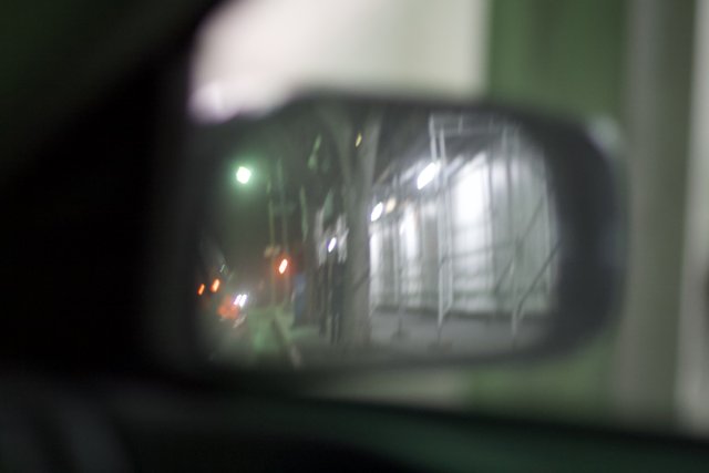 Street Reflection in Car Mirror