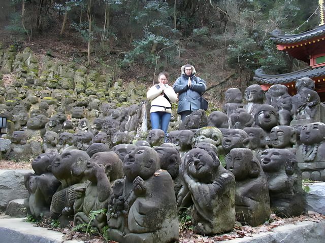 Standing in Awe Before Stone Statues