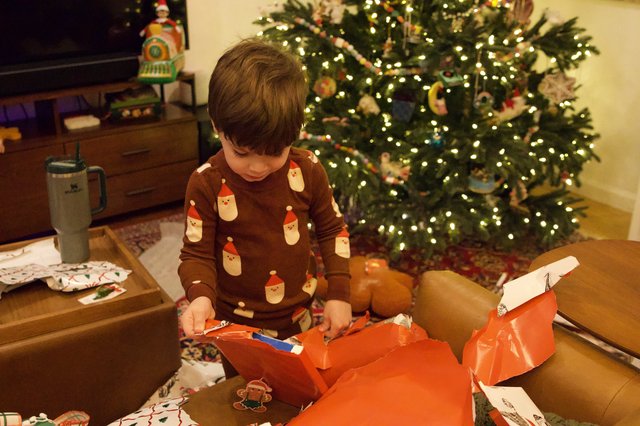 Christmas Morning Gift Opening with Decorated Tree