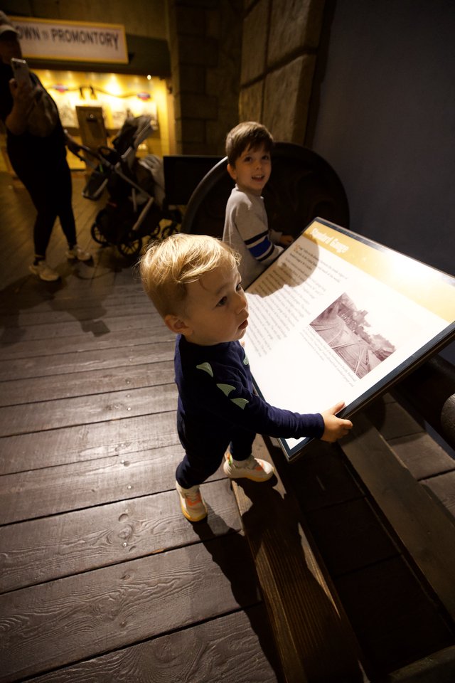 Young Boy Exploring Museum Exhibit Display