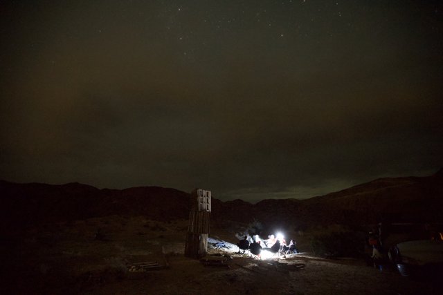 Nighttime Camping under the Starry Desert Sky