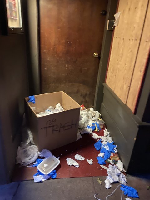 Trash Can Next to Door