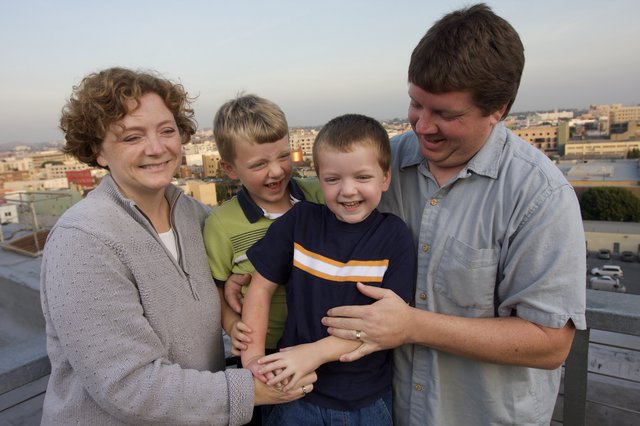 Happy Family Portrait on Urban Rooftop at Dusk