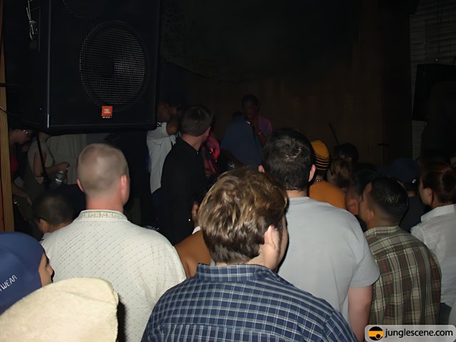 Speaker at Nightclub with Crowded Audience