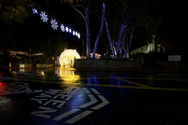 Festive Holiday Light Display on Rainy Night