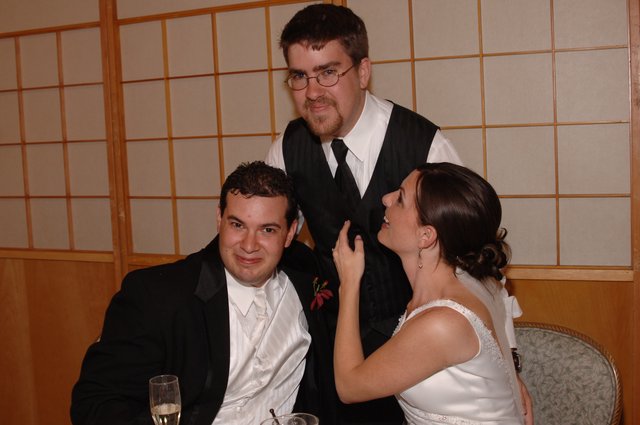 Wedding Reception Trio Sharing a Joyful Moment