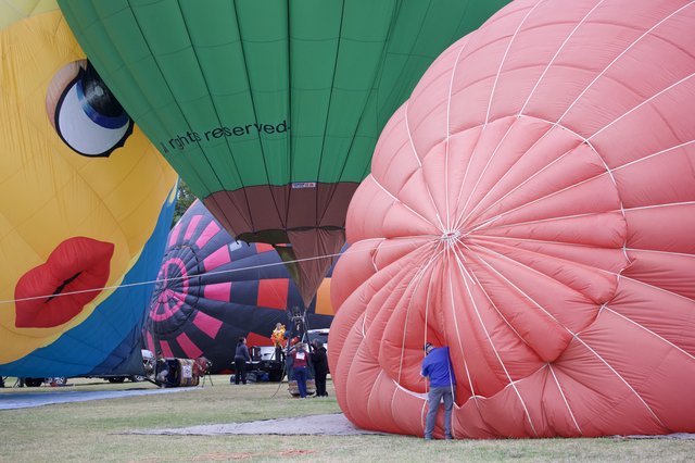 Ground Crew Inflates Colorful Balloons at Sonoma Classic