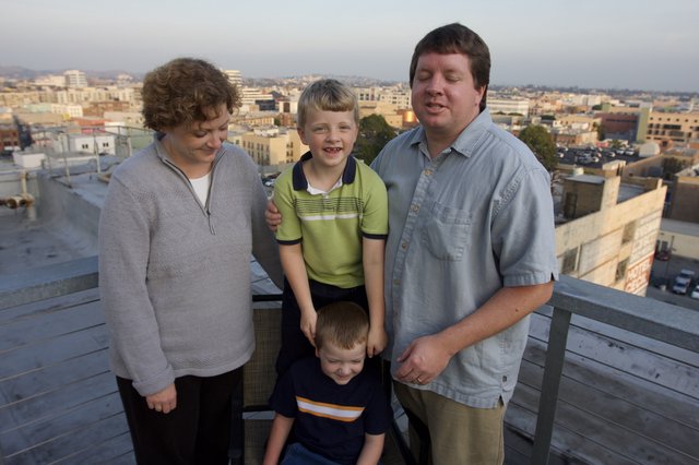 Family Portrait on Urban Rooftop at Dusk