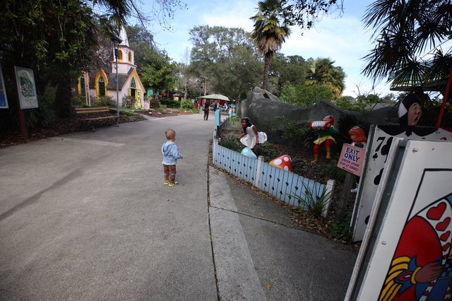 Child Exploring Whimsical Storybook Village Path