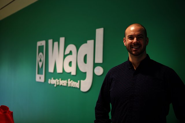 The Smiling Man in front of WAG Logo