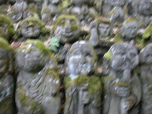 Stone Statues Covered in Moss