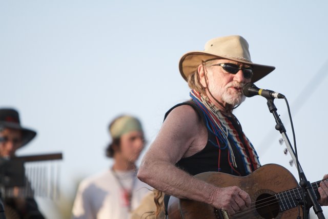 Willie Nelson's Iconic Cowboy Hat Shines Under Blue Skies at Okeechobee Music and Arts Festival