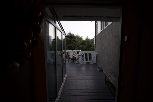Evening View Through Open Door to Covered Deck