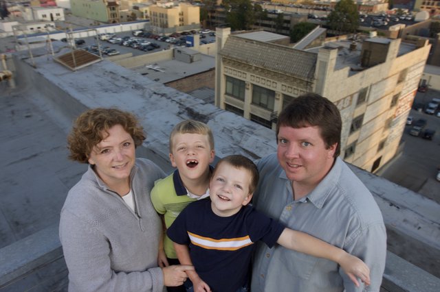 Family Portrait on Urban Rooftop at Dusk