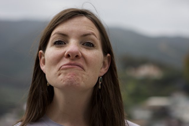 Woman Making a Pouty Face Outdoors in Mountains