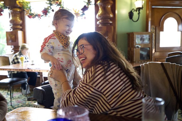 Joyful Mother-Daughter Moment at Restaurant