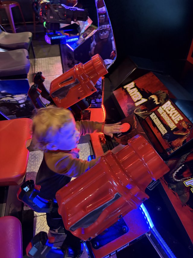Young Gamer Playing Retro Arcade Cabinet at Home
