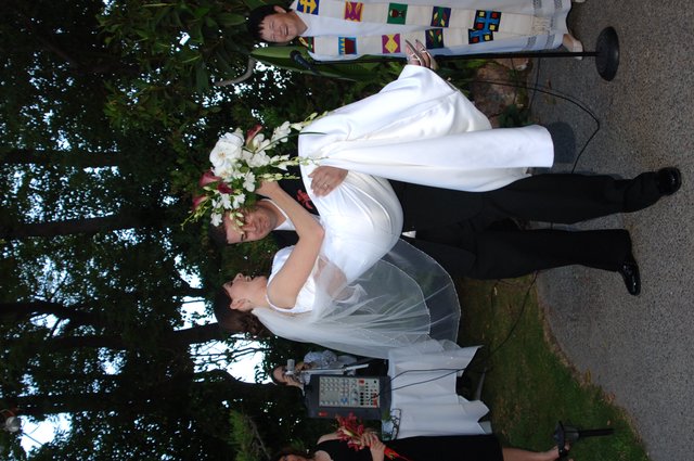 Groom Sweeps Bride Off Her Feet at Outdoor Wedding