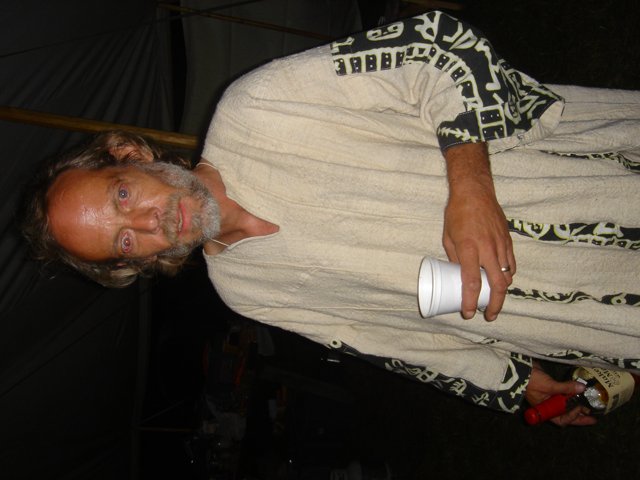 Robed Man Sips Coffee
