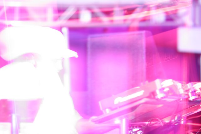 Keyboard Player in a Purple-lit Club