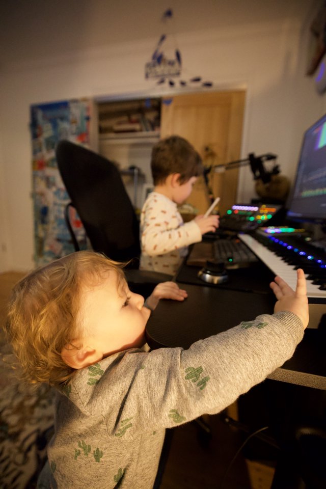 Young Brothers Making Music Together at Home