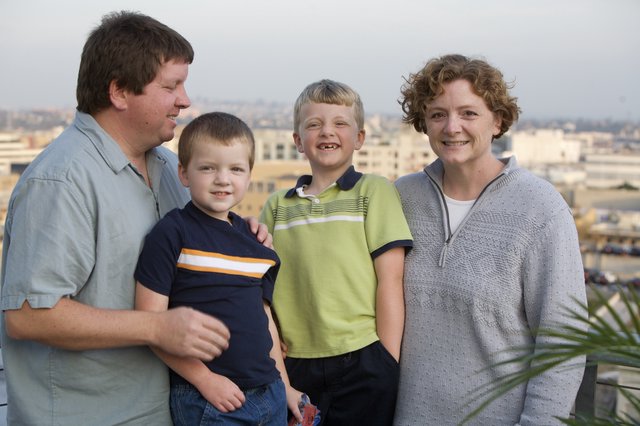 Family Portrait on Urban Rooftop at Dusk