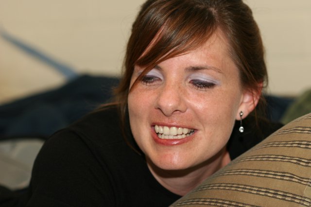 Candid Portrait of Smiling Young Woman on Couch