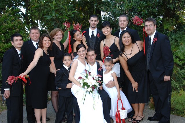 Joyful Wedding Party Portrait in Garden Setting