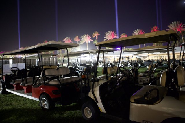 Nighttime Retreat: Golf Carts in the Field
