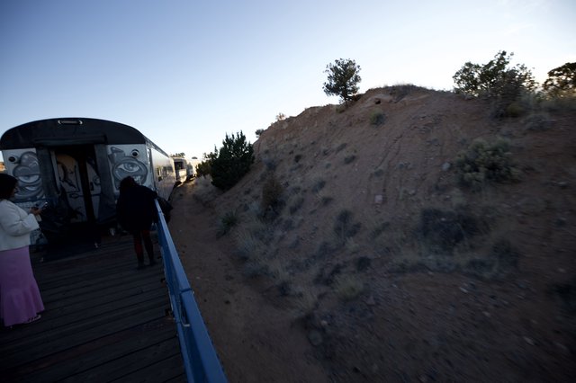 Twilight Train Journey Through Desert Hills