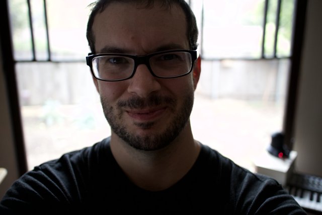 Portrait of a Happy Man with Glasses