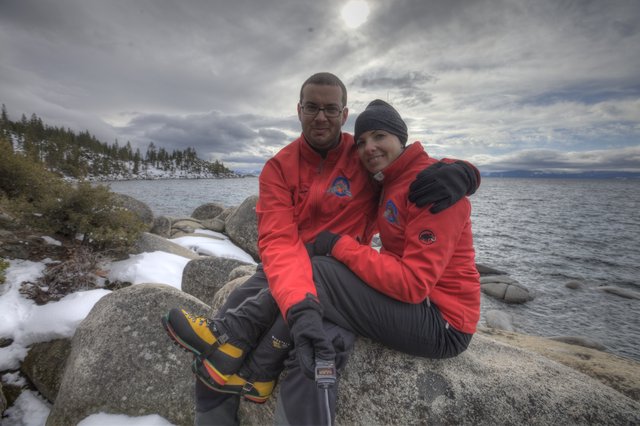 Couple Embracing on Snowy Lake Tahoe Shoreline
