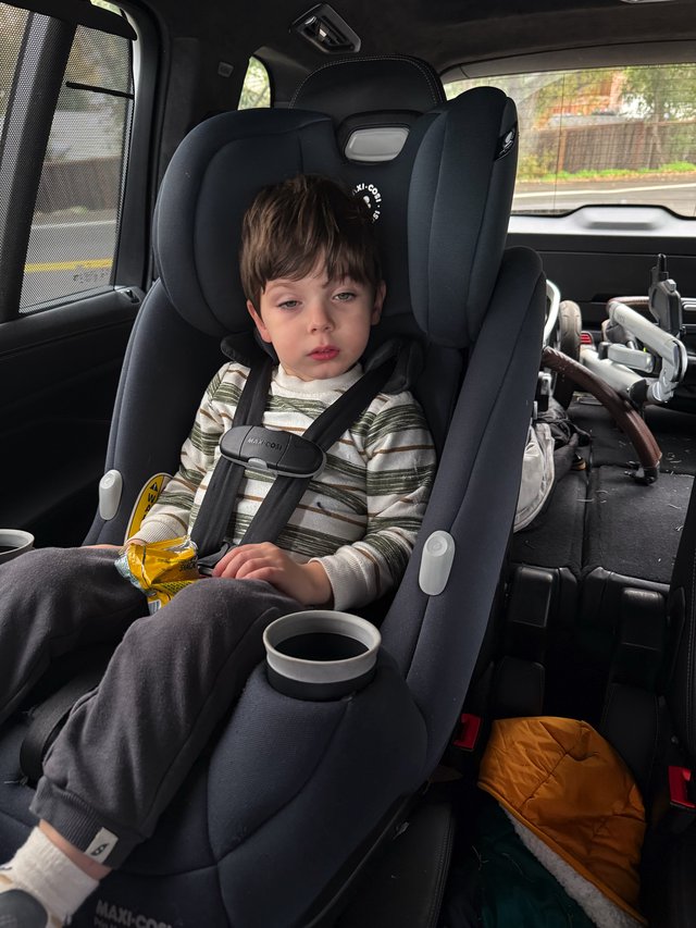 Young Child in Car Seat During Winter Journey