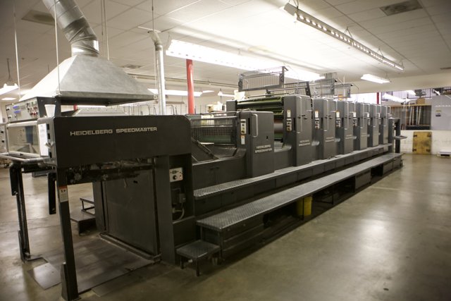 Massive Printing Machine in a Factory Warehouse