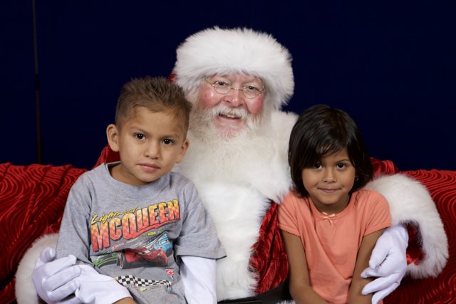Santa Claus Bringing Joy to Children at APC Xmas Party