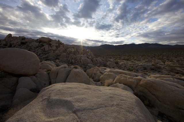 Rocky Landscape Shines under Sunlight Flares