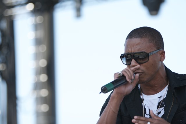 Lupe Fiasco with Microphone and Sunglasses