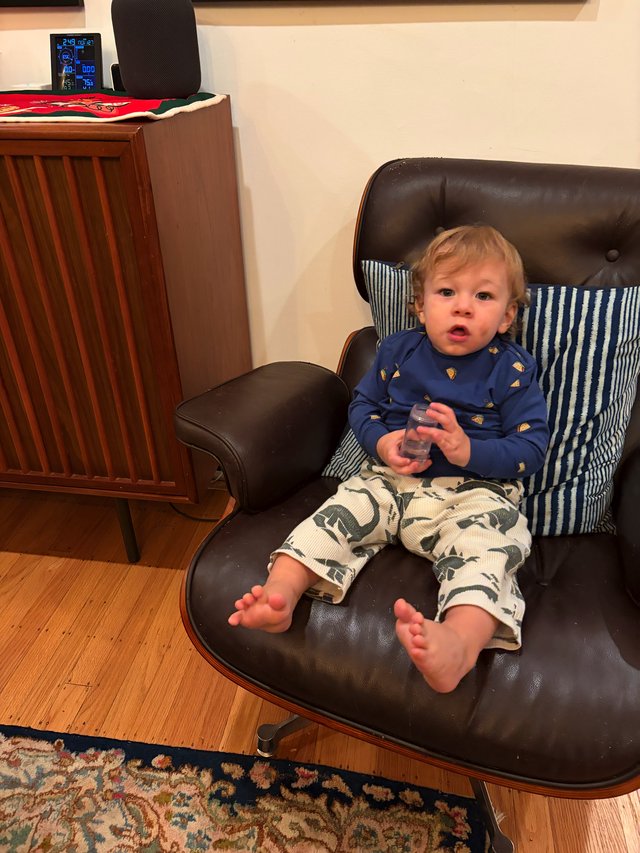 Toddler Relaxing in Mid-Century Modern Lounge Chair