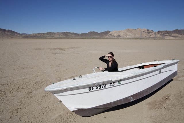 Lost at Sea: Boat Stranded in Desert Wasteland